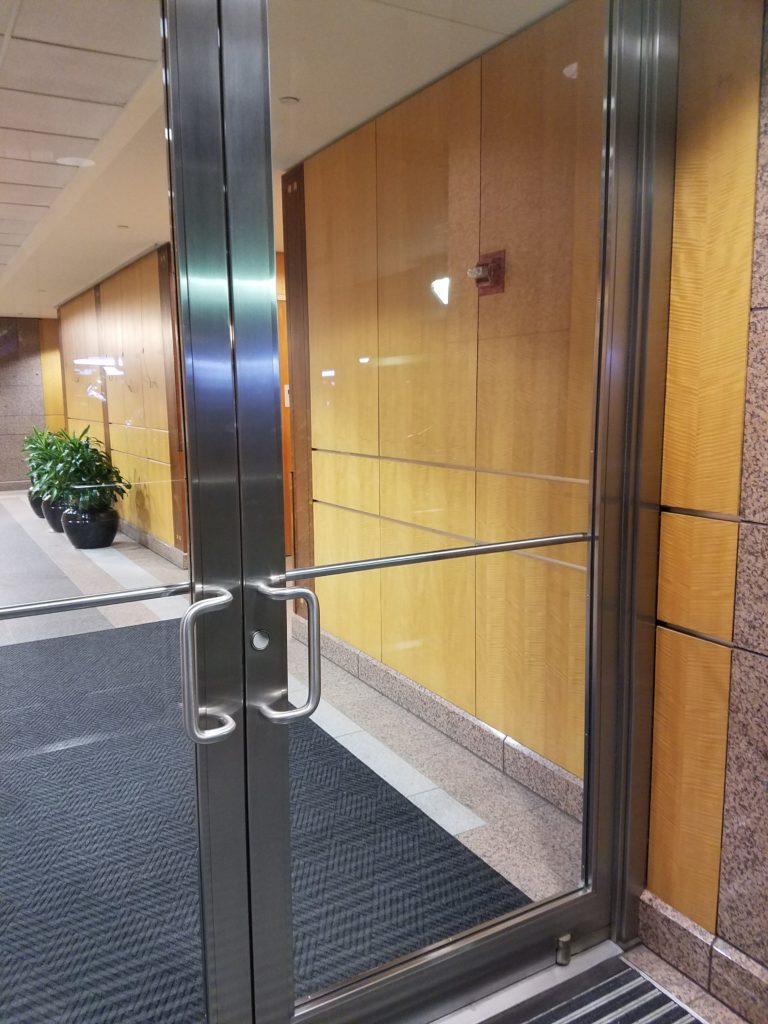 An inviting stainless steel entrance to the Block 89 Building