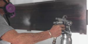 Spraying a sheet of metal